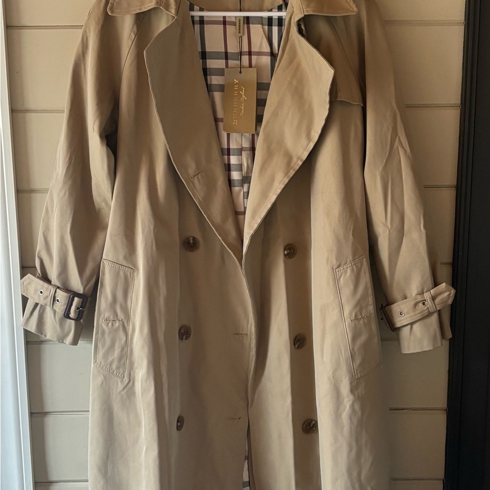 Burberry Women’s Tan Trench Coat.  Size large.  Runs really small.